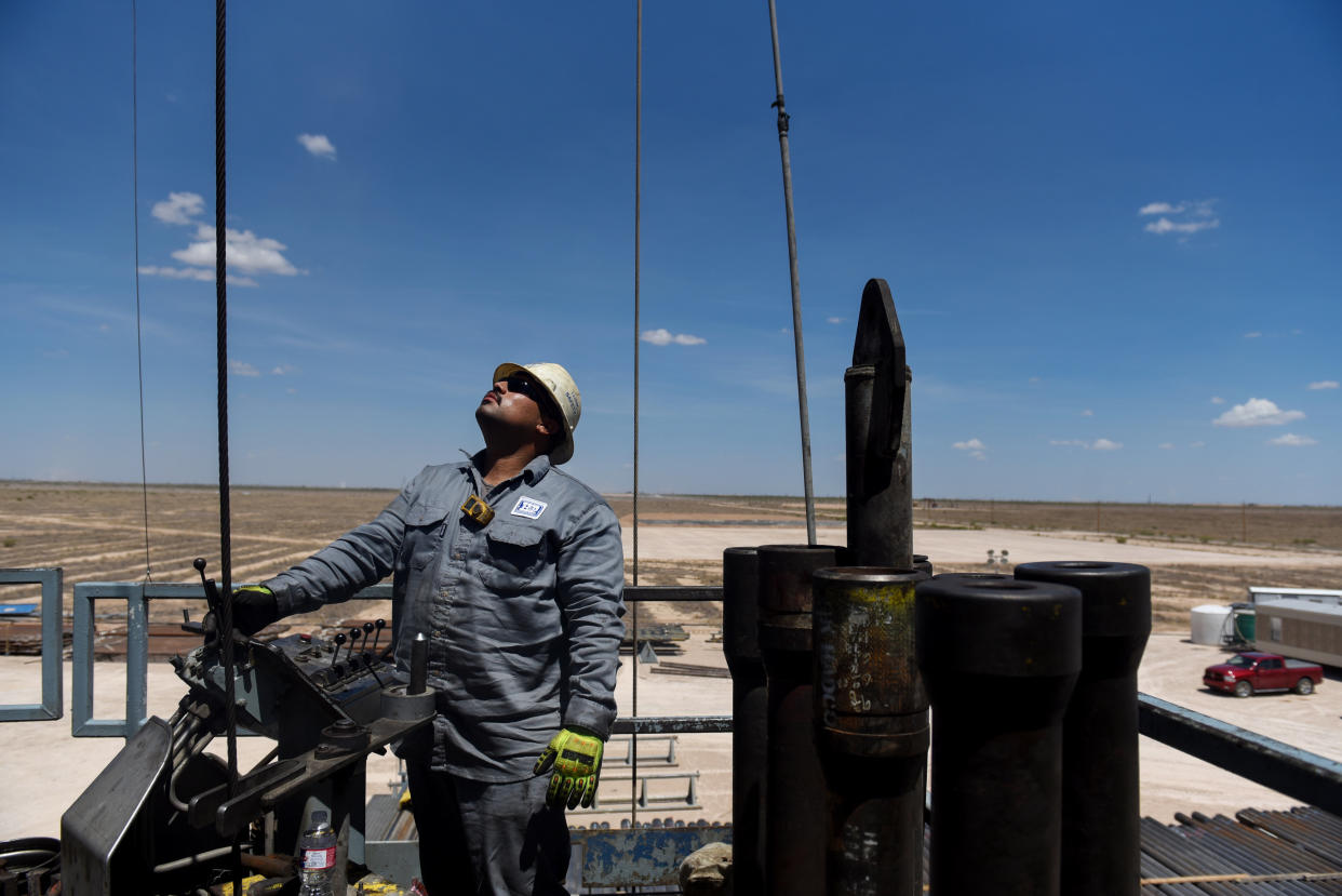A contractor works on a drilling site in the Permian Basin, a massive field stretching from Texas to New Mexico. (Bloomberg via Getty Images)