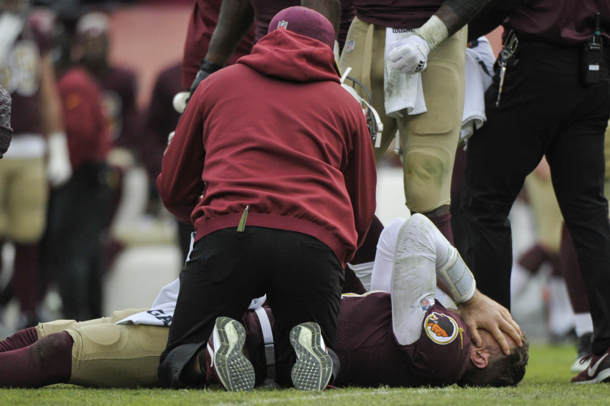 Washington Redskins quarterback Alex Smith reacts after suffering a broken leg against the Texans. (AP)