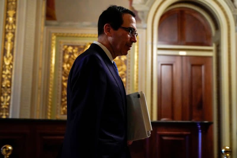 FILE PHOTO: FILE PHOTO-U.S. Secretary of the Treasury Mnuchin walks to the meeting for a coronavirus relief package in Washington