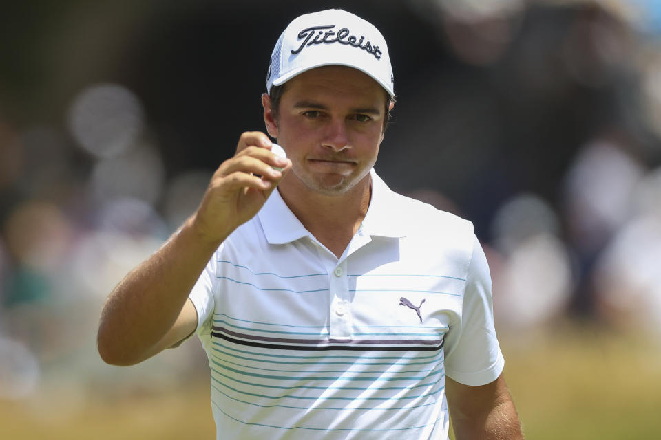 Australia's David Micheluzzi acknowledges the crowd after making a birdie on the first hole during the Australian Open golf championship at Victoria golf course in Melbourne, Australia, Saturday, Dec. 3, 2022. (AP Photo/Asanka Brendon Ratnayake)