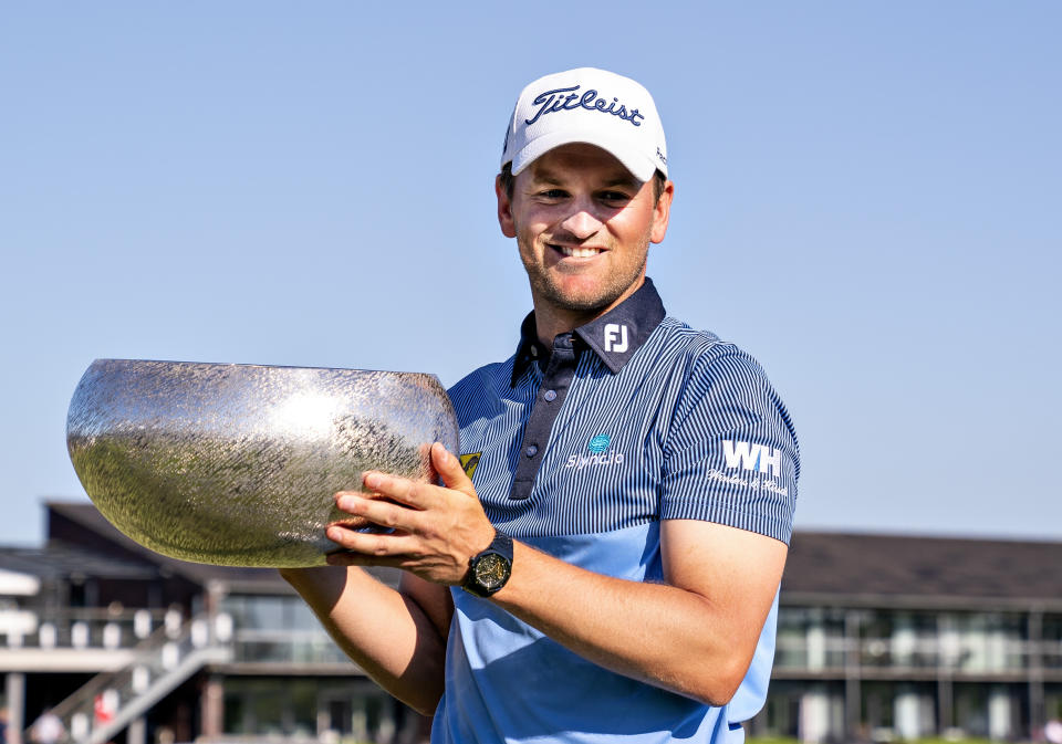 Bernd Wiesberger of Austria poses with the Himmerland Hill golftournament trophy after winning the European Tour golf tournament in Gatten, Denmark, Sunday May 30 2021. (Henning Bagger/Ritzau Scanpix via AP)