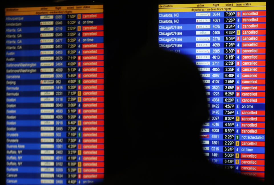 <p>An information screen shows canceled flights at the Air Train to JFK airport Wednesday, March 21, 2018, in the Queens borough of New York. (Photo: Frank Franklin II/AP) </p>