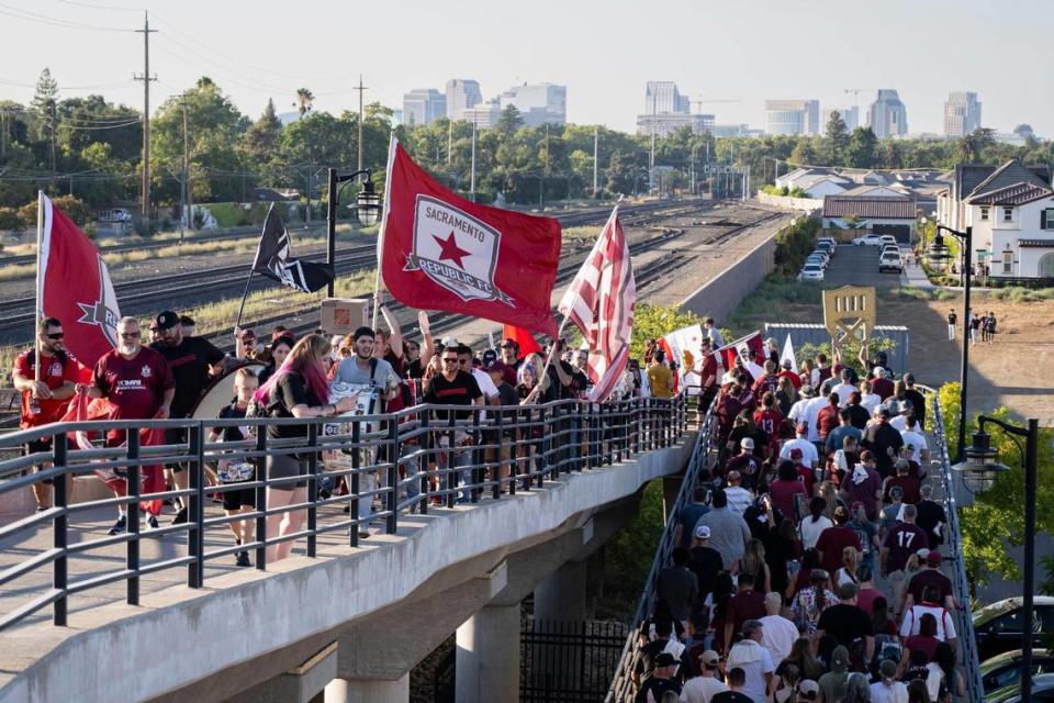 The Tower Bridge Battalion, a supporter union, leads the march from Track 7 Brewing to Hughes Stadium for the USL soccer game between Sacramento Republic FC and Orange County SC on Saturday.