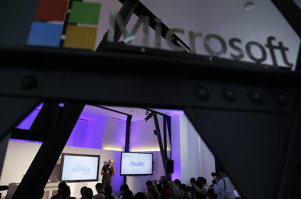 Microsoft CEO Satya Nadella gestures on stage while speaking during a press briefing on the intersection of cloud and mobile computing Thursday, March 27, 2014, in San Francisco. Microsoft unveiled Office for the iPad, a software suite that includes programs such as Word, Excel and PowerPoint, and works on rival Apple Inc.'s hugely popular tablet computer. (AP Photo/Eric Risberg)