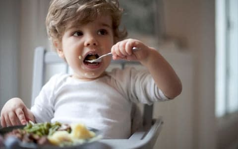 Mothers could also help their children by offering nuts before the age of one, new research suggests 