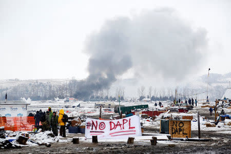 A fire burns in main opposition camp against the Dakota Access oil pipeline near Cannon Ball, North Dakota, U.S., February 22, 2017. REUTERS/Terray Sylvester