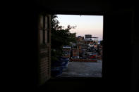 Houses are seen through a window of Tiki hostel in Cantagalo favela, in Rio de Janeiro, Brazil, April 15, 2016. REUTERS/Pilar Olivares