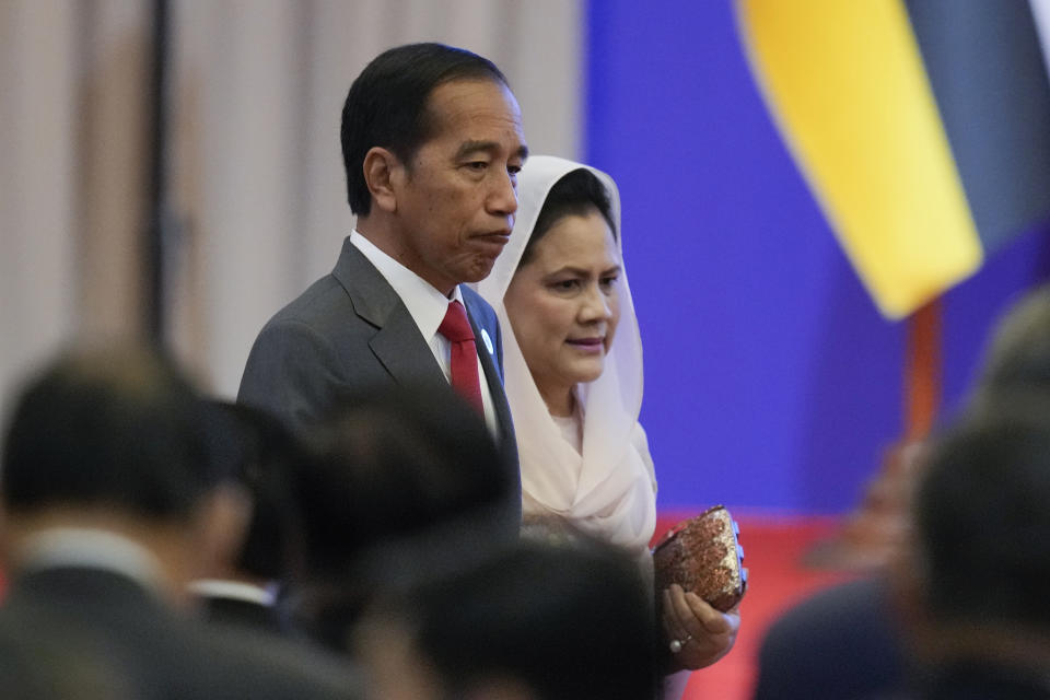 Indonesian President Joko Widodo and his wife Iriana arrive for the opening ceremony of the 40th and 41st ASEAN Summits (Association of Southeast Asian Nations) in Phnom Penh, Cambodia, Friday, Nov. 11, 2022. The ASEAN summit kicks off a series of three top-level meetings in Asia, with the Group of 20 summit in Bali to follow and then the Asia Pacific Economic Cooperation forum in Bangkok. (AP Photo/Vincent Thian)