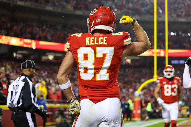 <p>Perry Knotts/Getty</p> Travis Kelce celebrating a touchdown