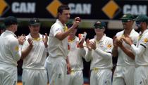 Australian paceman Josh Hazlewood celebrates his five wickets in an innings against India on the second day of their 2nd Test match, at The Gabba in Brisbane, on December 18, 2014