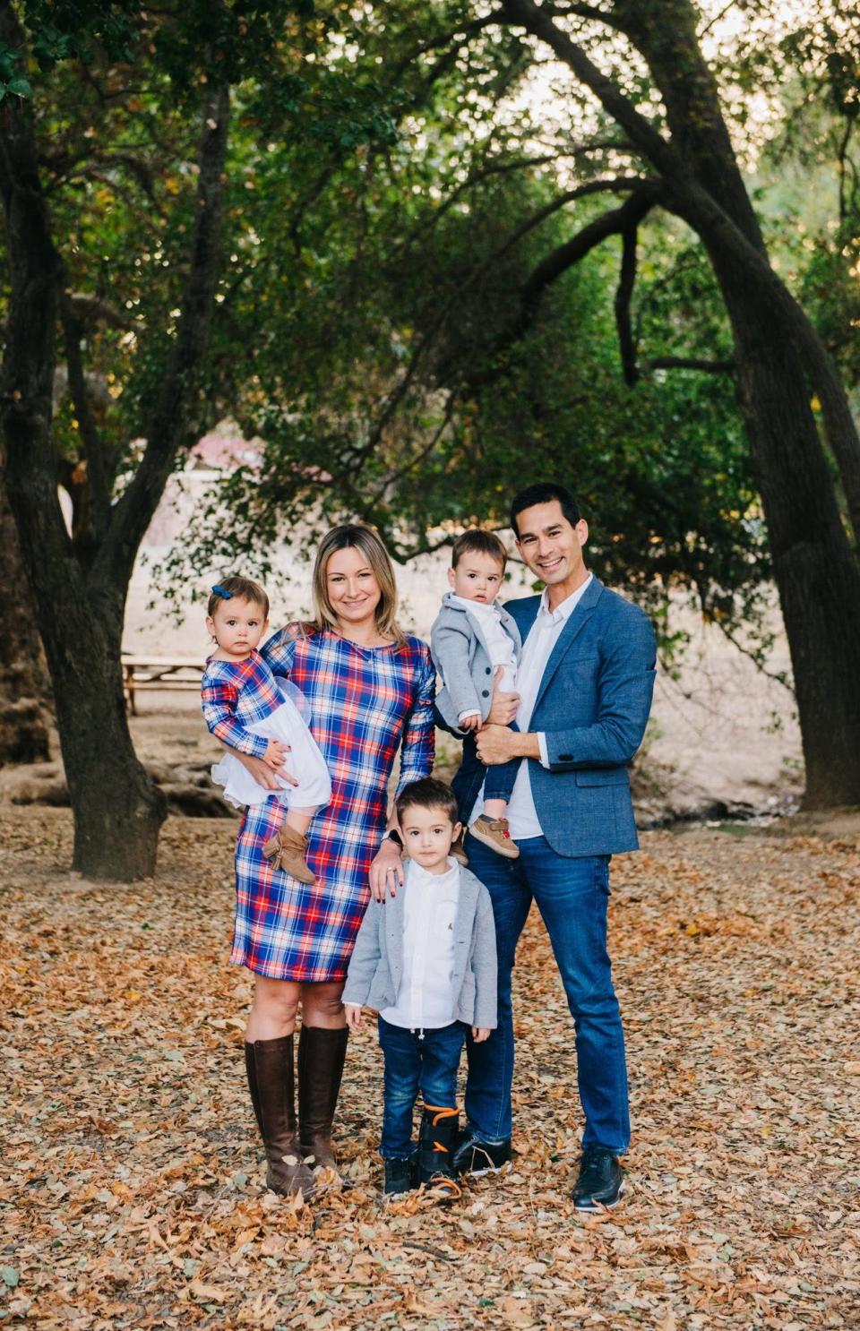 Nicole and Dan Oka with their children, Roman, and twins Dominic and Clara. The twins were unharmed when an Ikea bookcase tipped onto them in June.