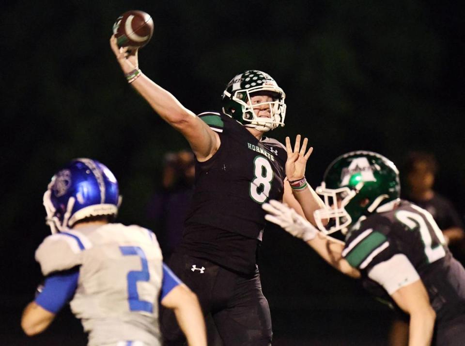 Azle quarterback Chris Lee, center throws down the field against Brewer in the second quarter of their district 3-5A Division 1 football game Friday, October 22, 2021 at Hornet Stadium in Azle, Texas. Special/Bob Haynes