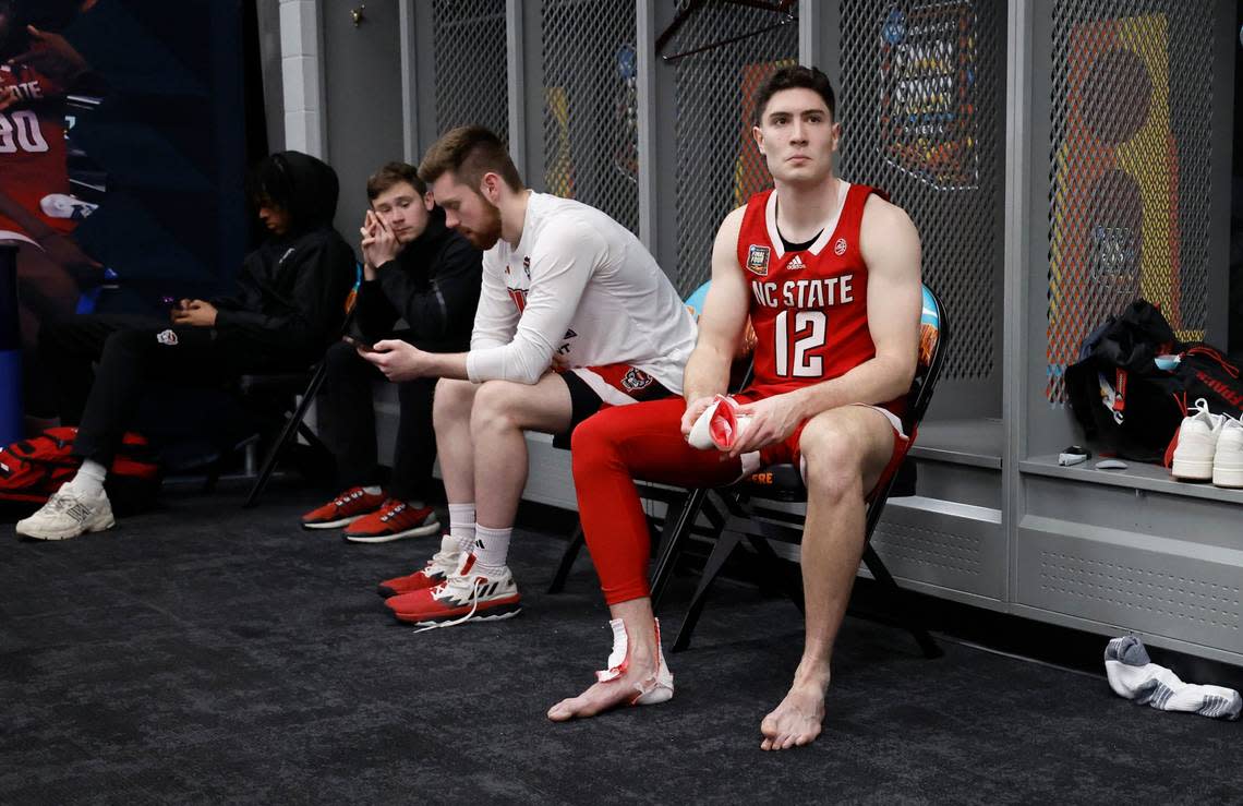 N.C. State’s Michael O’Connell (12) sits in the locker room after Purdue’s 63-50 victory over N.C. State in the NCAA Tournament national semifinals at State Farm Stadium in Glendale, Ariz., Saturday, April 6, 2024. Ethan Hyman/ehyman@newsobserver.com