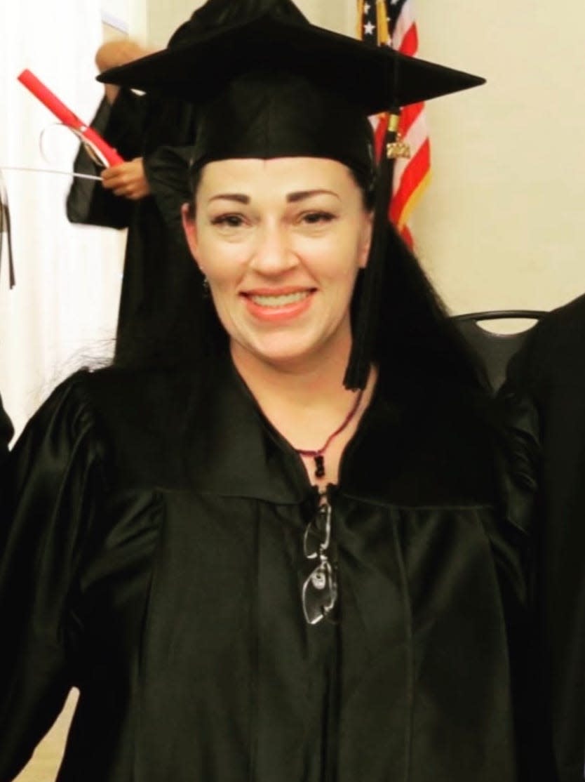 Melissa in a cap and gown