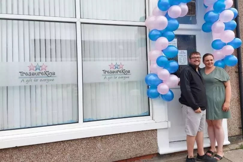 Kayleigh and her partner Chris outside the original shop