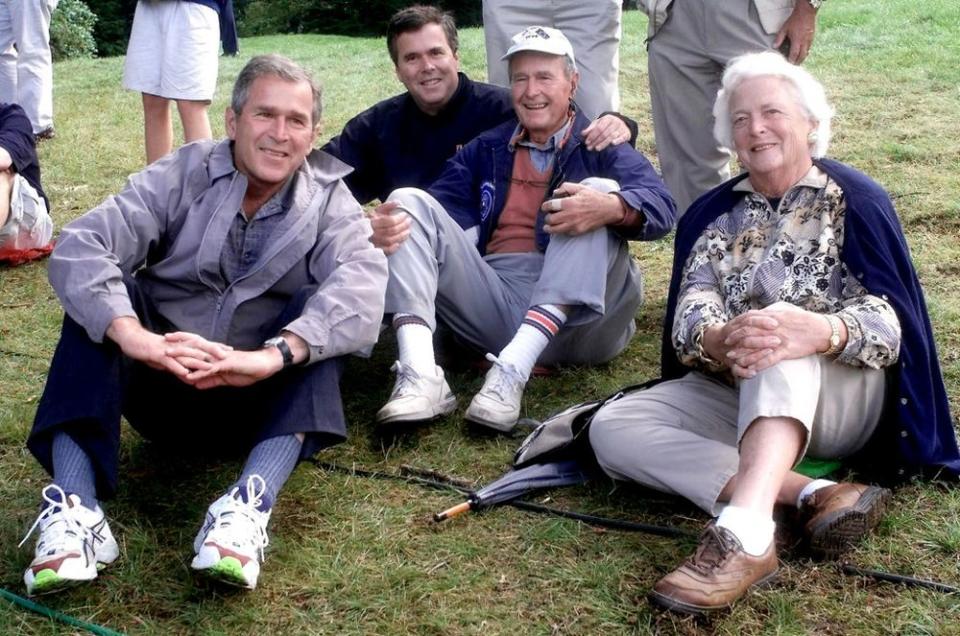 Former President George H. W. Bush (second from right) with his family in 1999 | JOHN MOTTERN/AFP/Getty