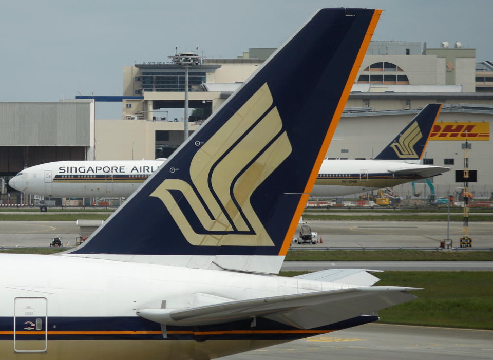 Singapore Airlines planes sit on the tarmac at Changi Airport in Singapore December 8, 2020.  REUTERS/Edgar Su