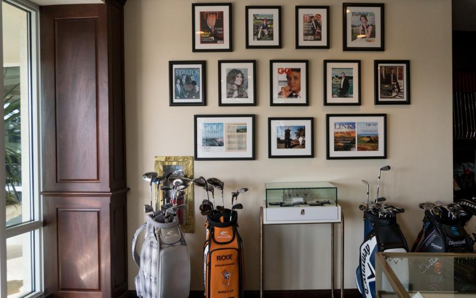 The fake Time magazine cover with other framed covers at the Trump National Doral Miami Golf Shop - Credit: The Washington Post via Getty Images