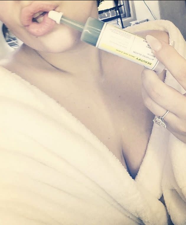 Lady Gaga injecting juice into her mouth. Photo: instagram.com/ladygaga.