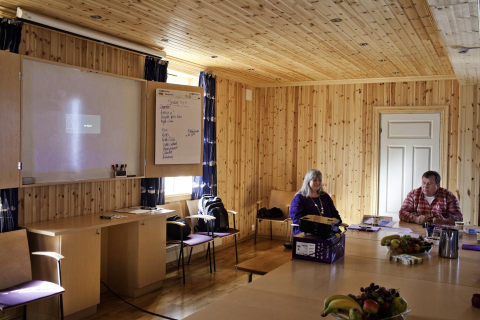 BASTOY ISLAND, HORTEN, NORWAY - APRIL 11:  Prison worker are seen holding a meeting to discuss how to use the animals as a tool with the inmates at the former Bastoy island's lighthouse in Bastoy Prison on April 11, 2011 in Bastoy Island, Horten, Norway. Bastoy Prison is a minimum security prison located on Bastoy Island, Norway, about 75 kilometers (46 mi) south of Oslo. The facility is located on a 2.6 square kilometer (1 sq mi) island and hosts 115 inmates. Arne Kvernvik Nilsen, governor of the prison, leads a staff of about 70 prison employees. Of this staff, only five employees remain on the island overnight.  Once a prison colony for young boys, the facility now is trying to become 'the first eco-human prison in the world.' Inmates are housed in wooden cottages and work the prison farm. During their free time, inmates have access to horseback riding, fishing, tennis, and cross-country skiing. (Photo by Marco Di Lauro/Reportage by Getty Images)