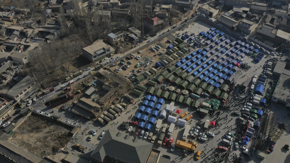 In this photo released by Xinhua News Agency, an aerial view show photo shows a temporary relocation site set up near damaged houses after the earthquake in Dahe Village of Jishishan County, northwest China's Gansu Province, Wednesday, Dec. 20, 2023. The strong earthquake that hit northwest China and killed at least 148 people, has caused tens of millions of estimated economic losses in the agricultural and fisheries industries, state media reported Saturday, Dec. 23, 2023. (Chen Bin/Xinhua via AP)