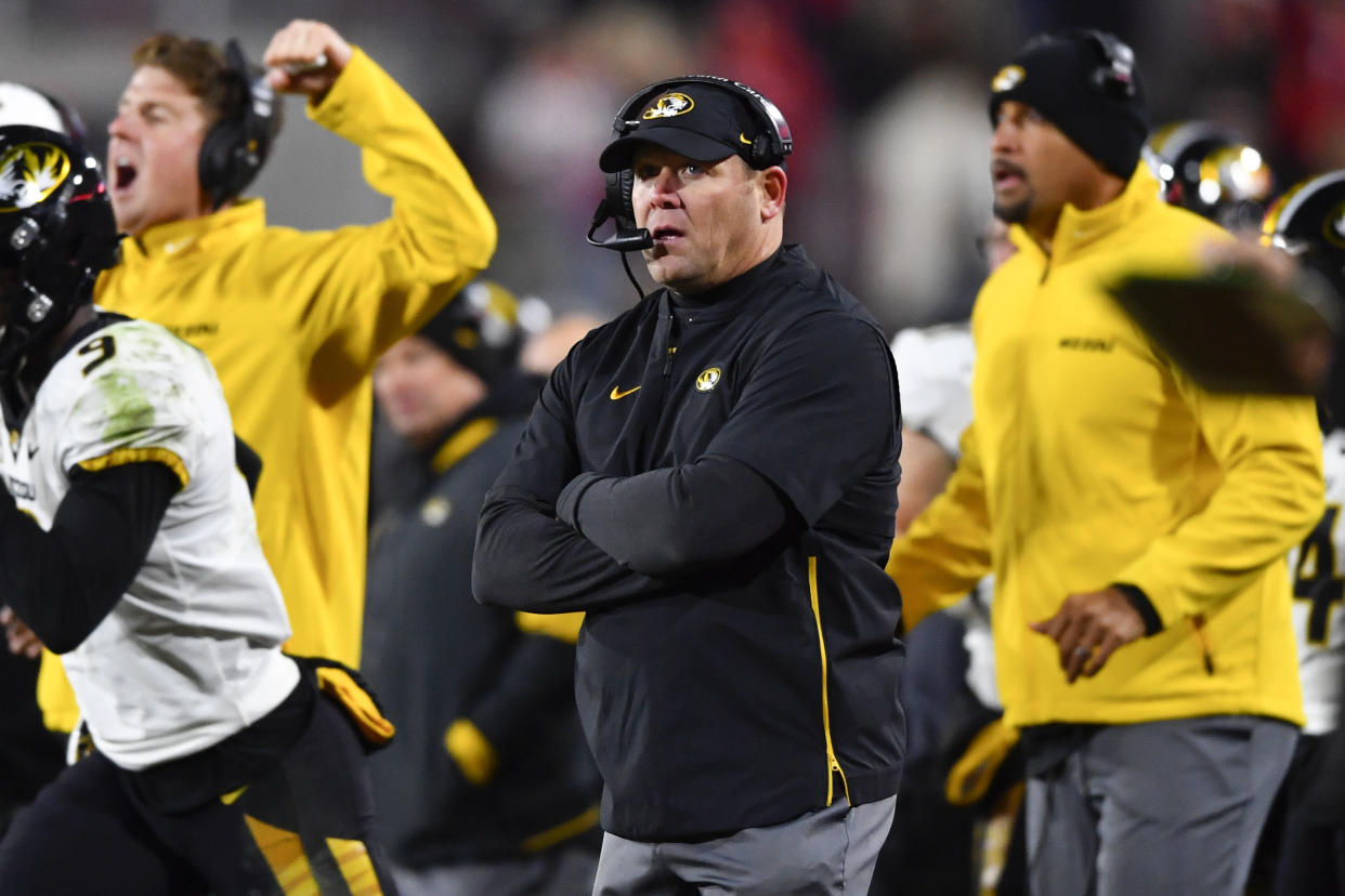 Missouri coach Barry Odom coaches of an NCAA college football game against Georgia, Saturday, Nov. 9, 2019, in Athens, Ga. (AP Photo/John Amis)