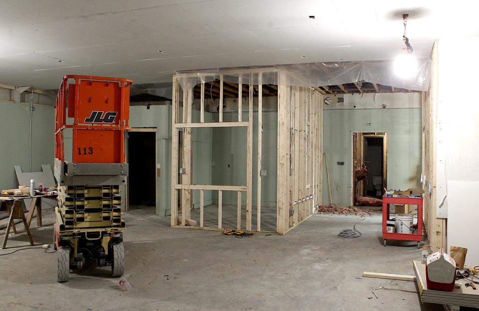 The Men's Warming Shelter, looking Westward from the front entrance. Meals have been served in this area, where the two by four framing forms a square.