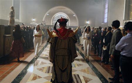 A member of the L.A. Dance Project portraying Kublai Khan performs the opera "Invisible Cities" at Amtrak's Union Station in Los Angeles November 15, 2013. REUTERS/Fred Prouser