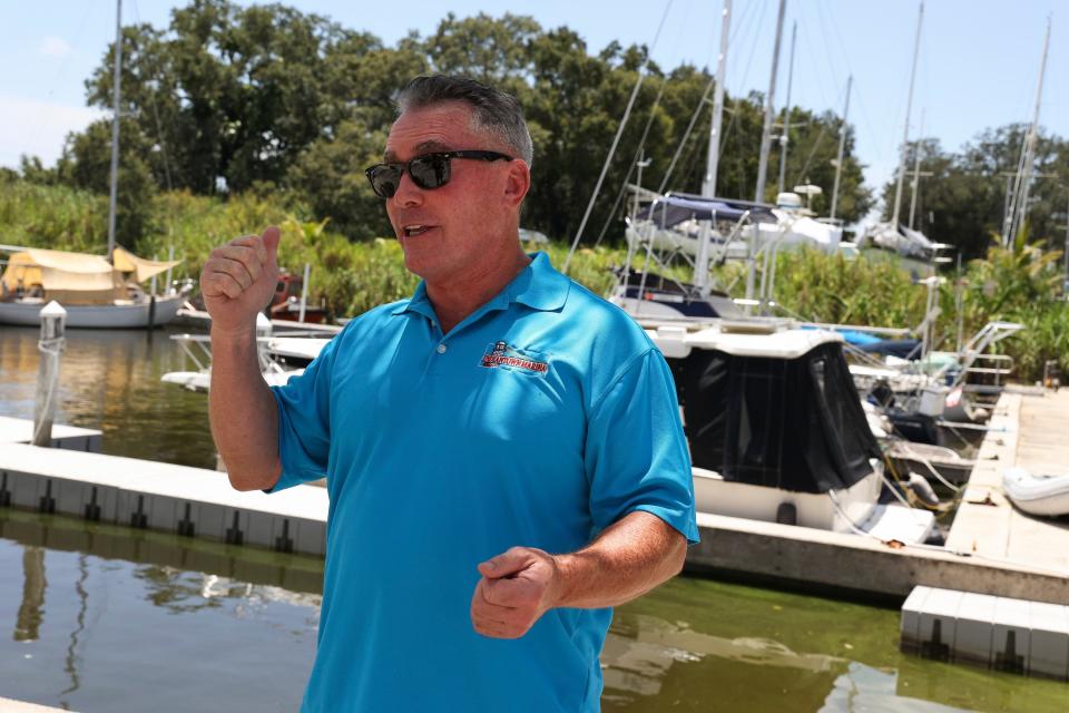 Scott Watson, owner of Indiantown Marina, talks with the media about the toxic algae in the water at the marina, Wednesday, Aug. 9, 2023, at 16300 S.W. Famel Blvd. "It can be somewhat unsightly," Watson said. "But as far as the overall health concerns and all this other stuff that you hear a lot of hype about, we have never experienced that."