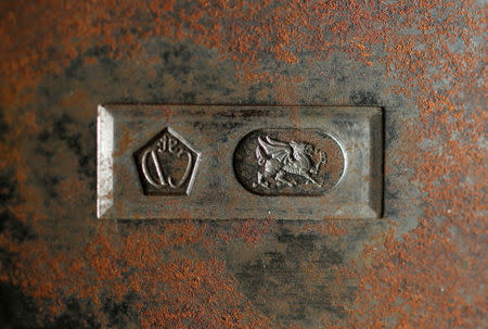 A vintage hallmarking press featuring a Welsh Dragon is seen at the Clogau office in Bodelwyddan, North Wales, Britain, March 12, 2018. REUTERS/Phil Noble