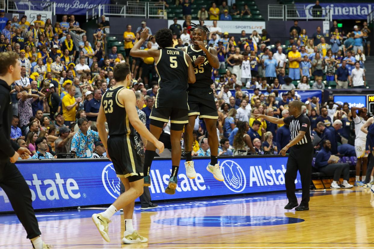 HONOLULU, HAWAII - NOVEMBER 22: Myles Colvin #5 and Lance Jones #55 of the Purdue Boilermakers celebrate after winning the Allstate Maui Invitational at SimpliFi Arena on November 22, 2023 in Honolulu, Hawaii. (Photo by Darryl Oumi/Getty Images)