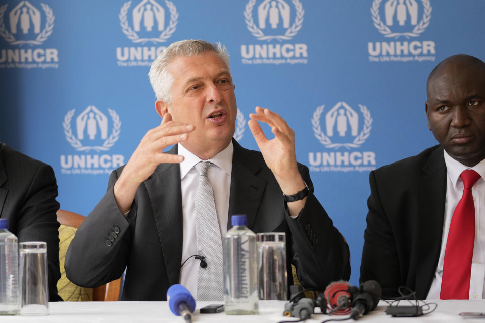 United Nations High Commissioner for Refugees Filippo Grandi, center, speaks during a press conference accompanied by Principal Secretary for Immigration and Citizens Services Julius Bitok, right, in Nairobi, Kenya on the occasion of World Refugee Day Tuesday, June 20, 2023. Grandi visited the east African country and met with President William Ruto to show his appreciation for the country's planned integration programs allowing refugees to become self-sufficient. (AP Photo/Khalil Senosi)
