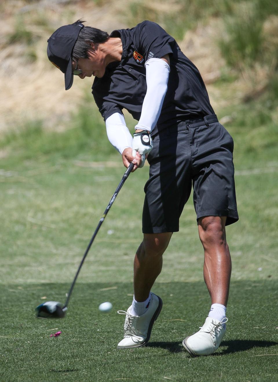 Ivan Tran tees off on the sixth hole for Palm Desert High School during the Desert Empire League golf championships at the Mission Hills North Gary Player Signature Course in Rancho Mirage, Calif., May 3, 2023.