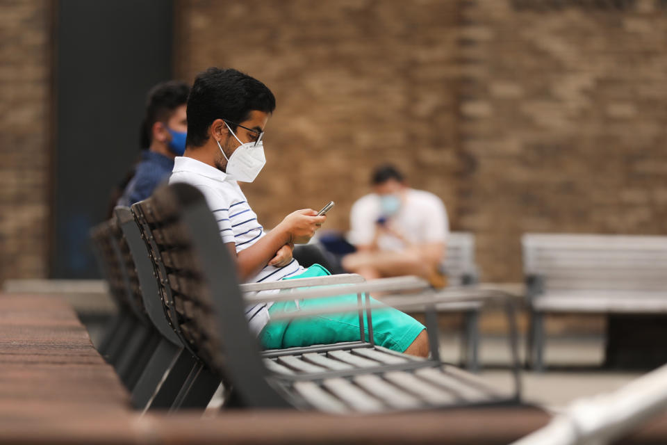 NEW YORK, NEW YORK - AUGUST 25: Students at New York University (NYU) wait outside of a Covid-19 test tent outside of its business school on August 25, 2020 in New York City. All students arriving back to the campus are required to get tested for the virus upon arrival, students will then have to be tested again seven to 10 days later. Classes are set to begin on September 2. (Photo by Spencer Platt/Getty Images)