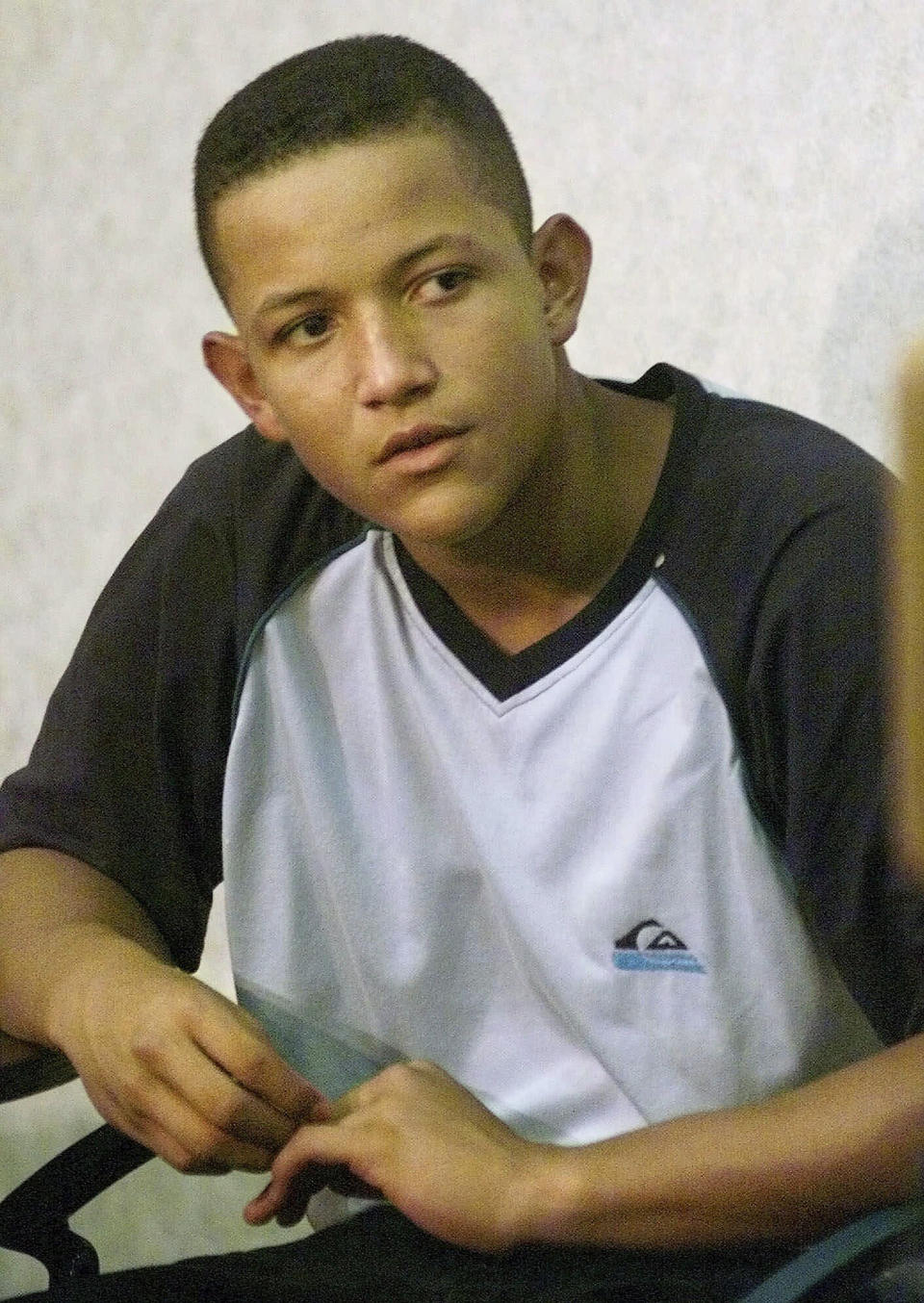 FILE - Sixteen-year-old Miguel Cabrera, of Maracay, Venezuela, looks on during a press conference where it was announced that he had been signed by the Florida Marlins to a Gulf Coast League contract with the Melbourne Marlins, prior to a game between the Marlins and the Philadelphia Phillies, Aug. 4, 1999, at Pro Player Stadium in Miami. (AP Photo/Tony Gutierrez, File)