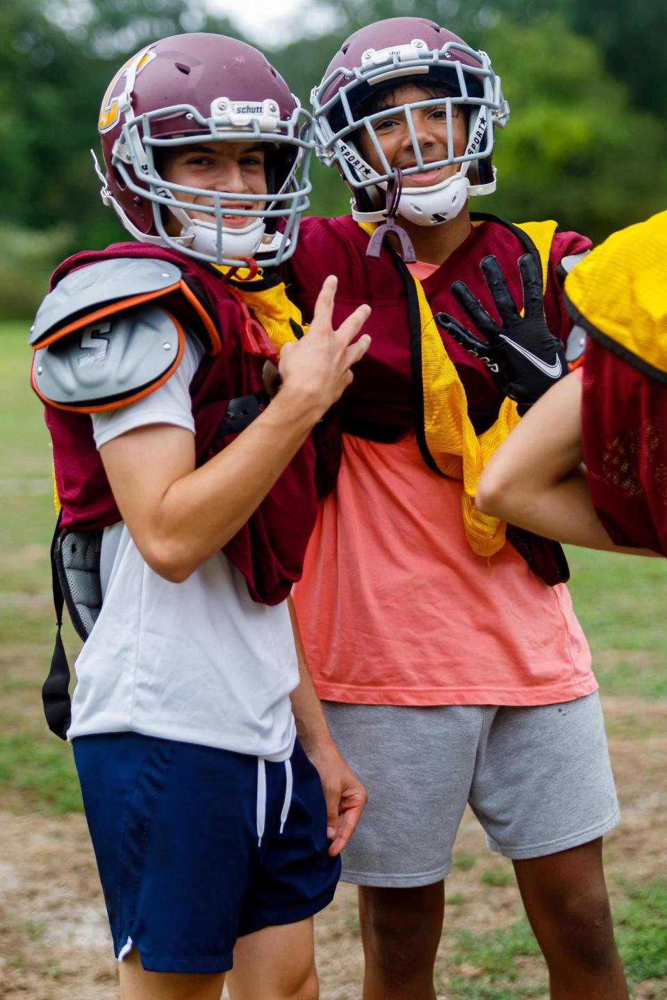Case football players smile during Tuesday's football practice.