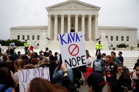 FILE PHOTO: Protesters rally against U.S. Supreme Court nominee Brett Kavanaugh at the Supreme Court in Washington, U.S., September 27, 2018. REUTERS/Joshua Roberts/File Photo