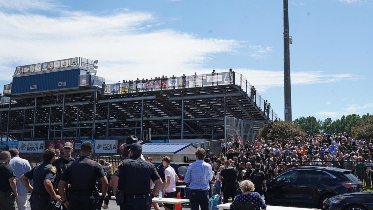 PHOTO: Law enforcement officers work the scene as students wait to be picked up by their parents after a shooting at Apalachee High School on September 4, 2024 in Winder, Georgia. (Megan Varner/Getty Images)