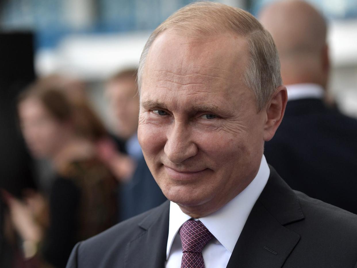 Vladimir Putin grinning