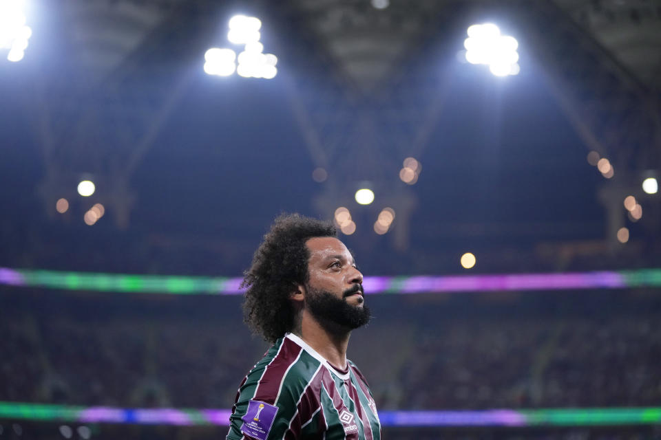 Fluminense's Marcelo leaves the pitch after getting injured during the Soccer Club World Cup semifinal soccer match between Fluminense FC and Al Ahly FC at King Abdullah Sports City Stadium in Jeddah, Saudi Arabia, Monday, Dec. 18, 2023. (AP Photo/Manu Fernandez)