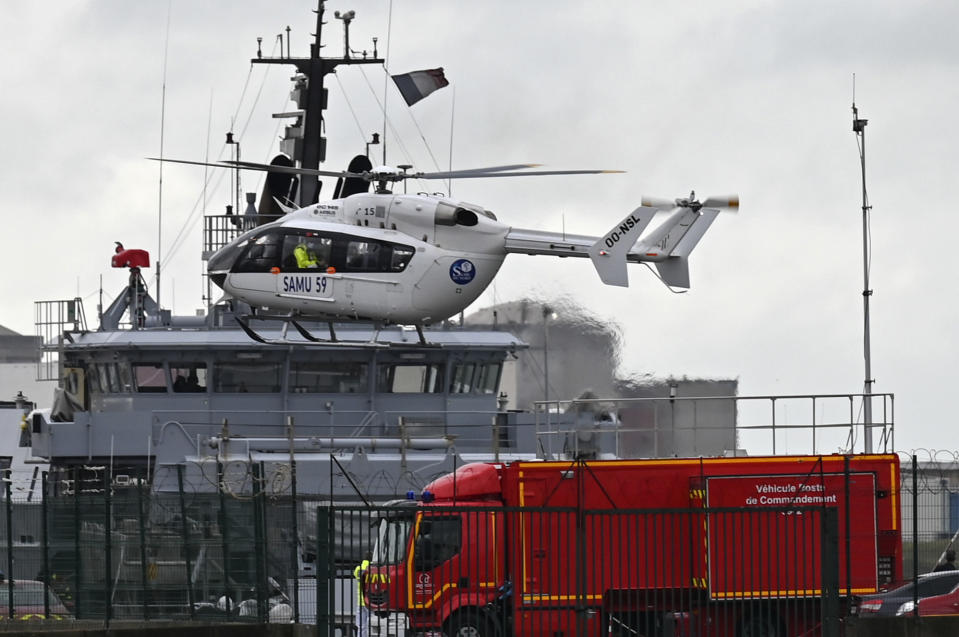 A French rescue helicopter lands close to a rescue vessel in Dunkirk, northern France, Tuesday, Oct. 27, 2020 during a search operation after four migrants, including a 5-year-old and 8-year-old child died Tuesday when their boat capsized while they and other migrants tried to cross the English Channel to Britain, French authorities said. Fifteen migrants have been saved so far and rescue and search operations are still under way, according to the regional administration for the Nord region. (AP Photo)