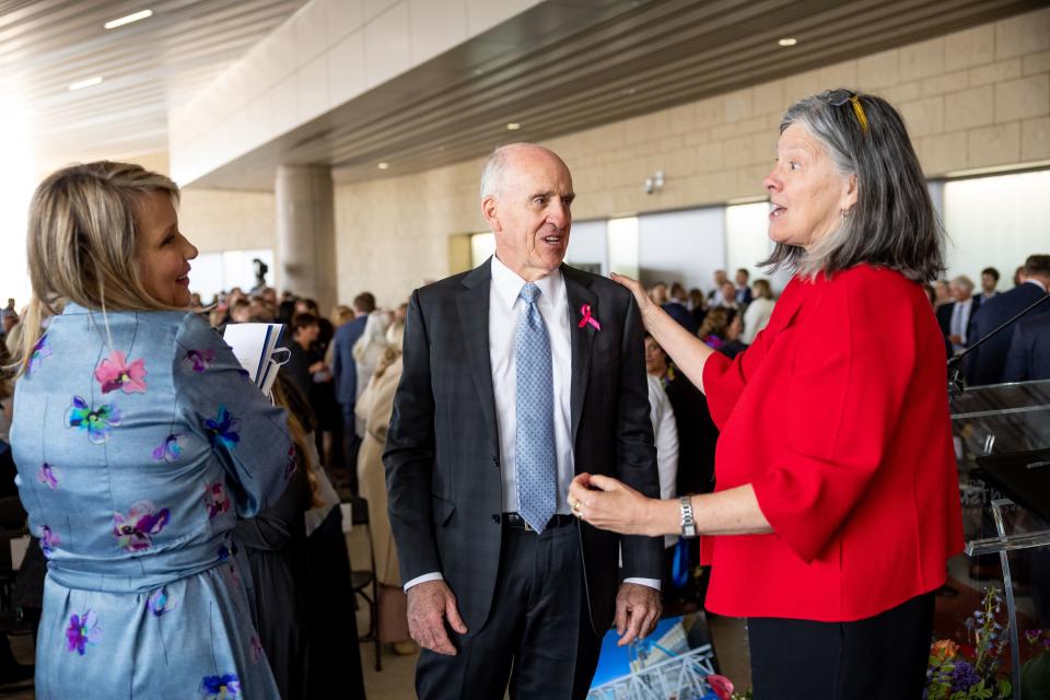 Kristen and Spencer Kirk, lead donors for the new Kathryn F. Kirk Center for Comprehensive Cancer Care and Women’s Cancers at Huntsman Cancer Institute, talk to Mary Beckerle, right, CEO of Huntsman Cancer Institute, in Salt Lake City on Monday, May 8, 2023. | Spenser Heaps, Deseret News