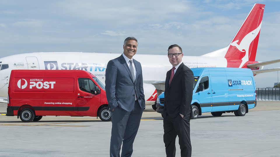 Australia Post managing director and group chief executive Ahmed Fahour (left) and Qantas Group chief executive Alan Joyce posing in Sydney.