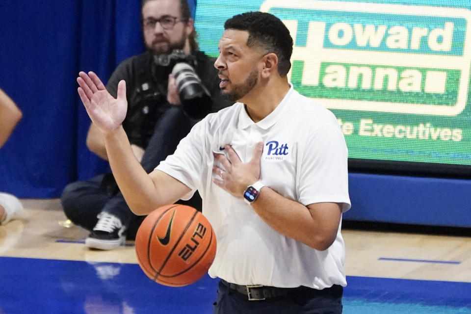 The ball is thrown past Pittsburgh head coach Jeff Capel as he gestures during the second half of an NCAA college basketball game against West Virginia, Friday, Nov. 11, 2022, in Pittsburgh. (AP Photo/Keith Srakocic)