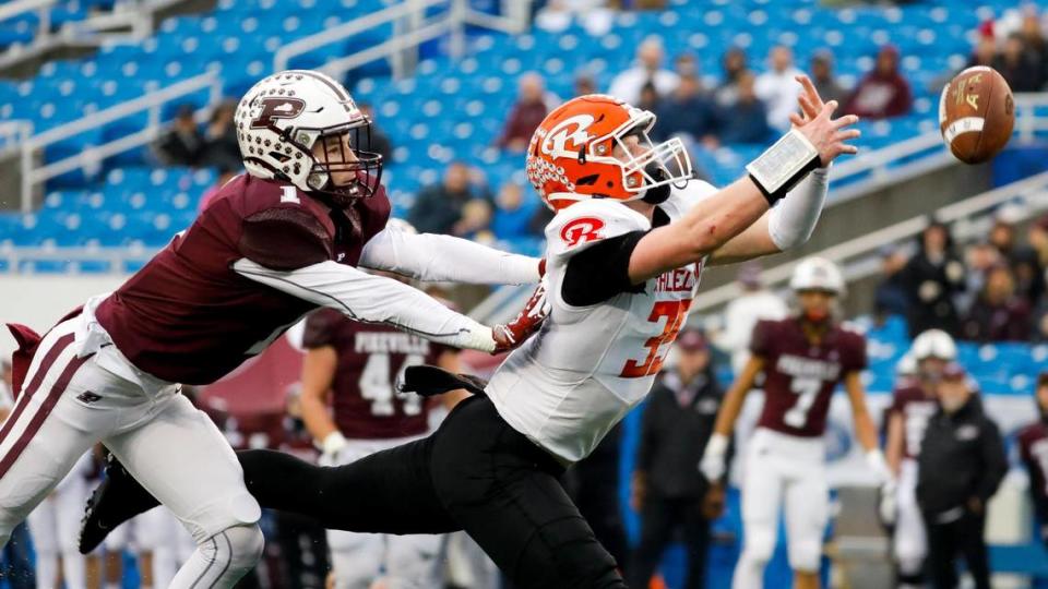 Raceland’s Brayden Webb (35) can’t haul in a reception as Pikeville’s Bradyn Hall (1) defends during Friday’s Class A state championship game at Kroger Field.