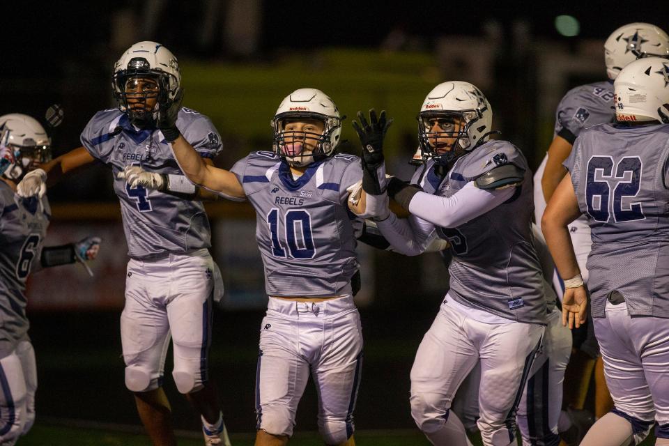 Howell's Ray Defrancesco (#10) celebrates a touchdown with his teammates during the first half of the Marlboro vs. Howell high school football game at Howell High School in Farmingdale, NJ Friday, September 23, 2022.