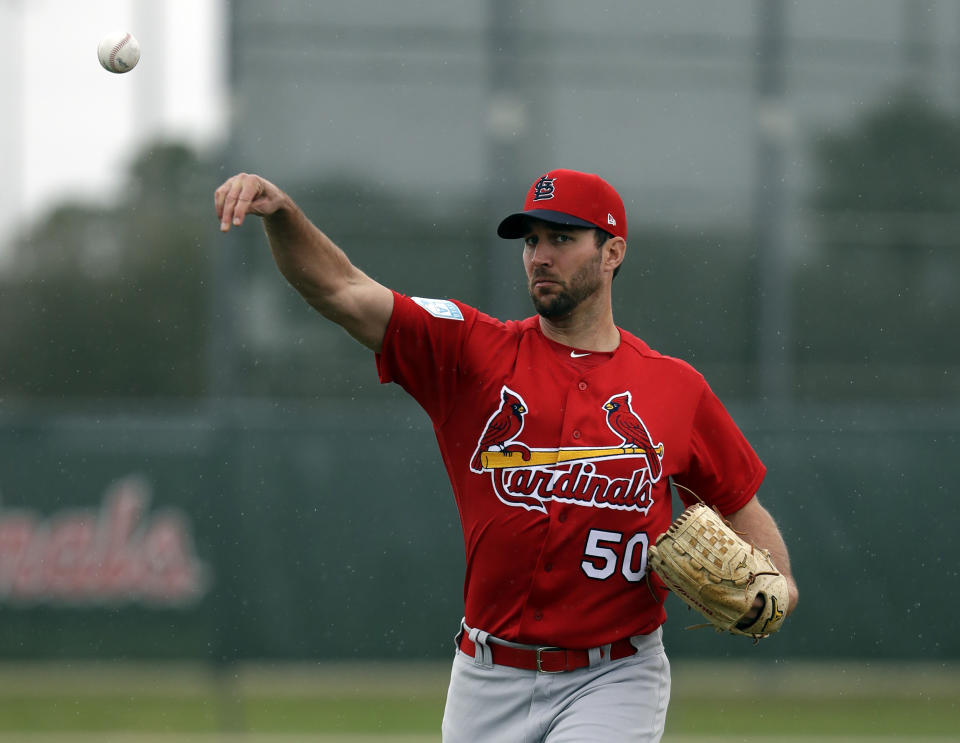 Cardinals pitcher Adam Wainwright expresses worry that the players could walkout during the season if issues with the owners aren't fixed. (AP)