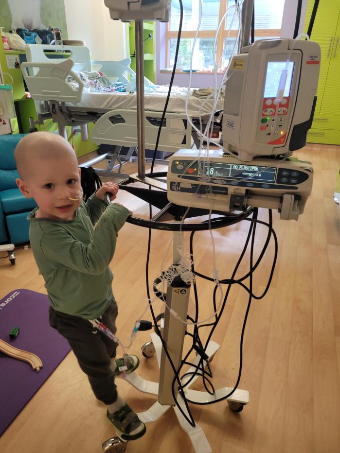 Boy next to hospital equipment 