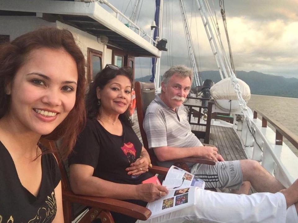 Retired British geologist Jim Fitton, right, with his wife Sarijah Fitton, centre, and his daughter Leila Fitton (Family handout/PA) (PA Media)