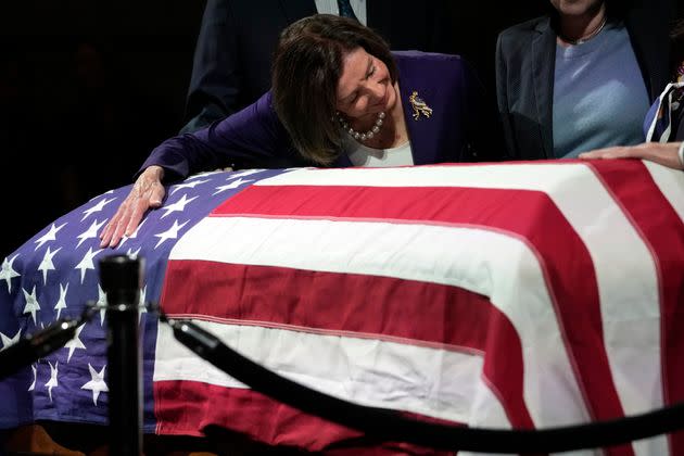 Rep. Nancy Pelosi (D-Calif.) puts her arm around the casket of Sen. Dianne Feinstein (D-Calif.) at San Francisco City Hall on Oct. 4, 2023.